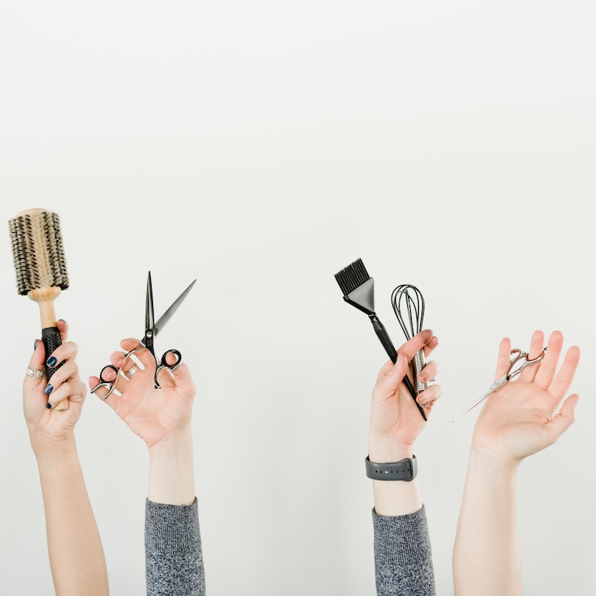 hands with hair tools